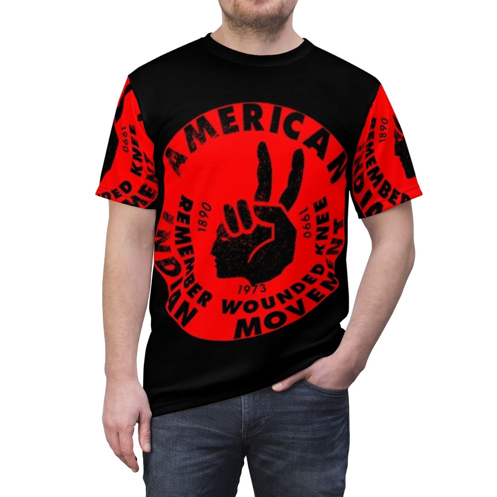 Graphic T-shirt design featuring the American Indian Movement logo and empowering message. - men front