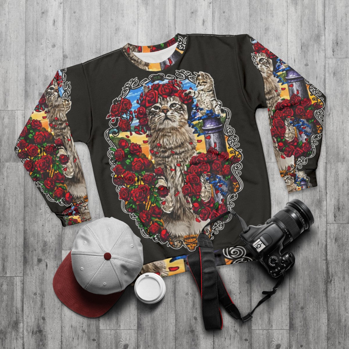 Grateful cats and psychedelic roses design on a sweatshirt - flat lay