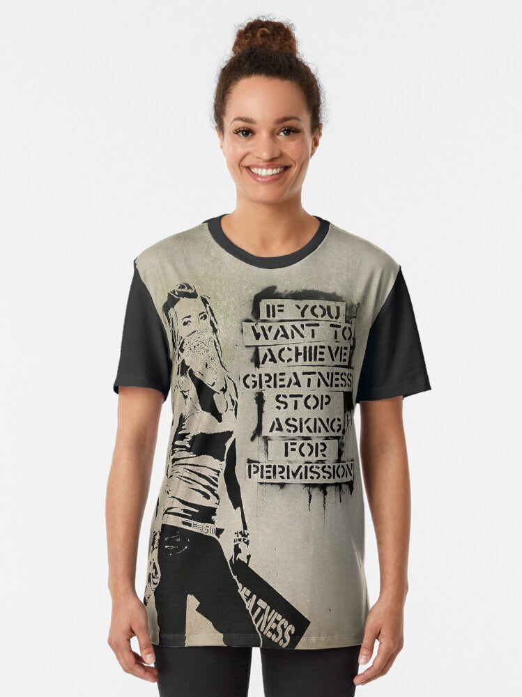 Banksy quote graphic t-shirt featuring the text "If You Want to Achieve Greatness, Stop Asking for Permission" in a bold, black and white graffiti-inspired style. - Women