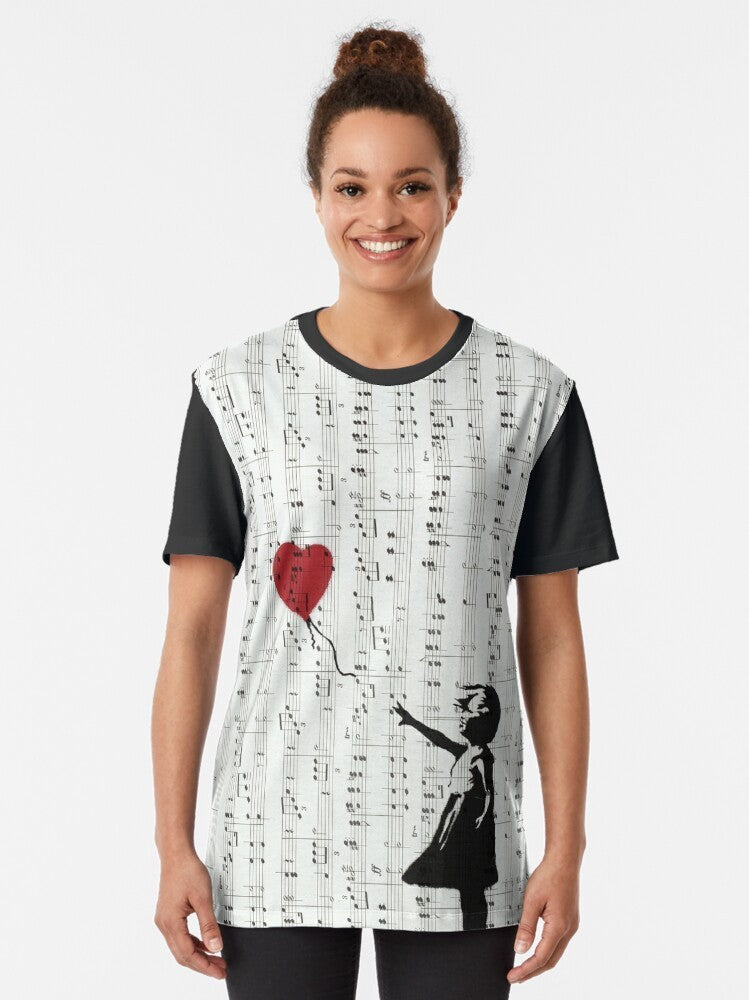 Banksy's iconic "Girl With a Red Balloon" street art design on a contemporary graphic t-shirt - Women