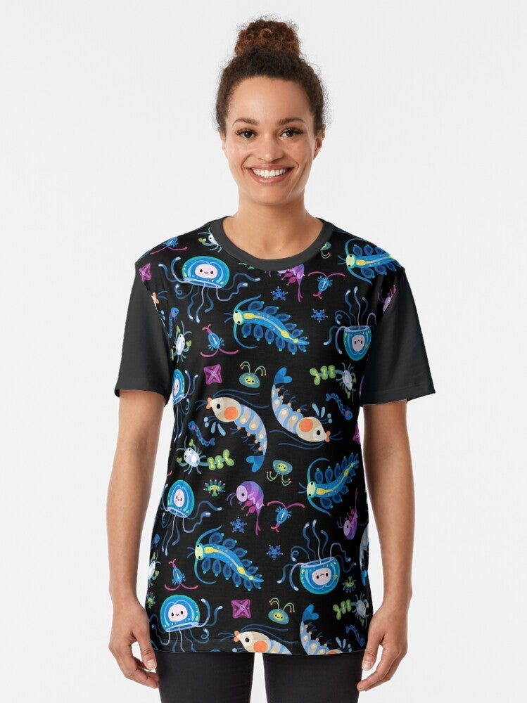 Graphic t-shirt featuring colorful illustrations of various zooplankton species, including krill, copepods, jellyfish, and more. - Women