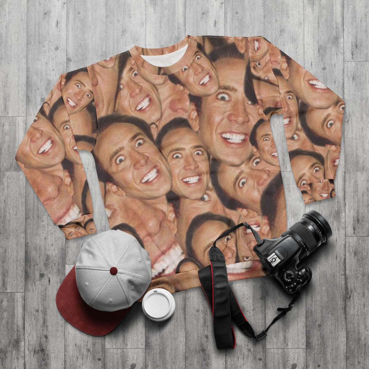 Nicolas Cage face collage design on a sweatshirt - flat lay