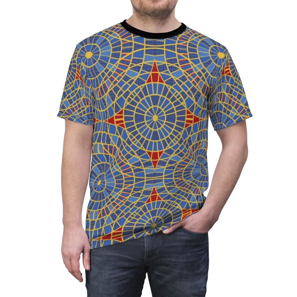 Close-up of a repeating geometric carpet pattern in red, blue, and yellow colors, printed on a t-shirt - men front