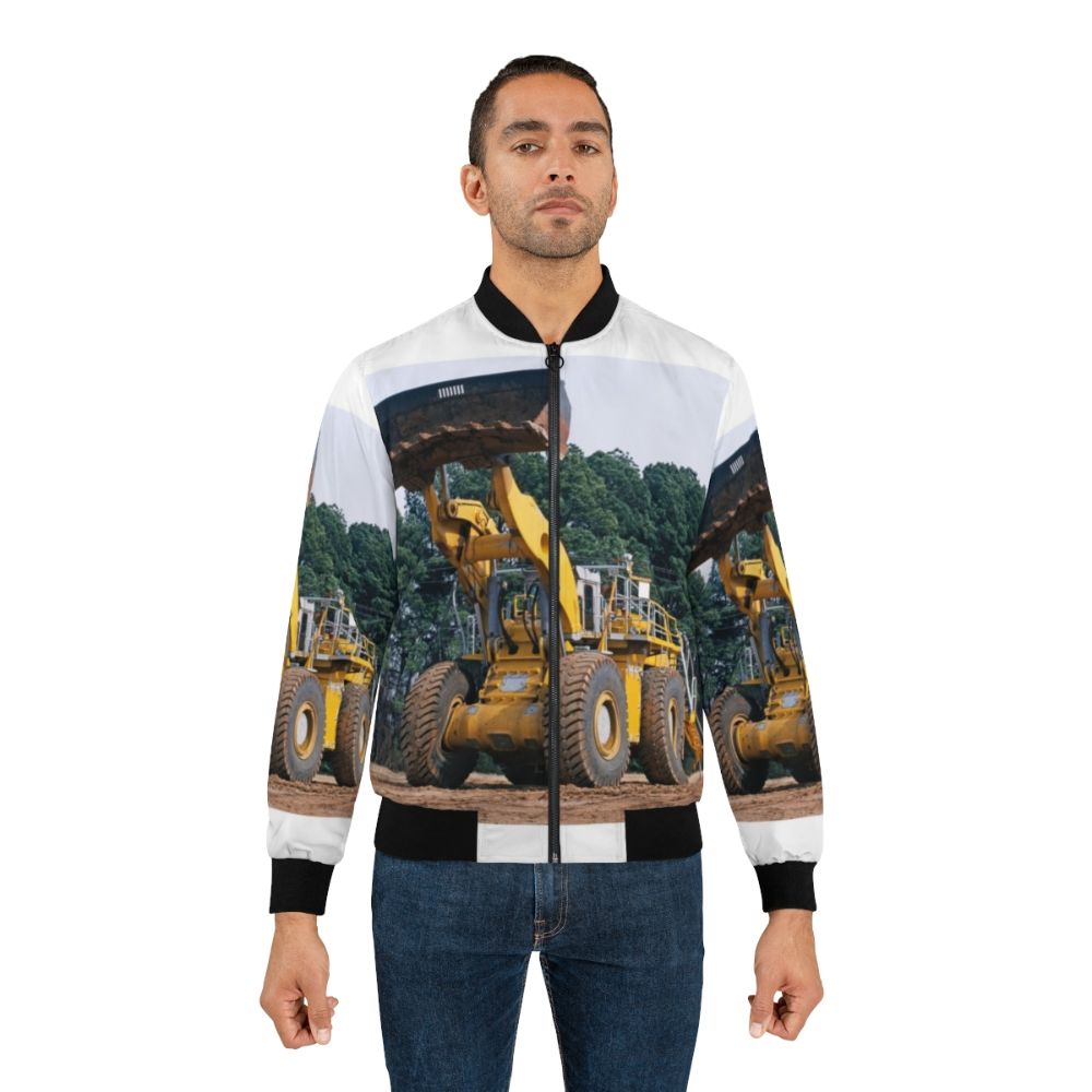 A bomber jacket with wheel loader equipment graphic design, showcasing industrial technology and machinery. - Lifestyle