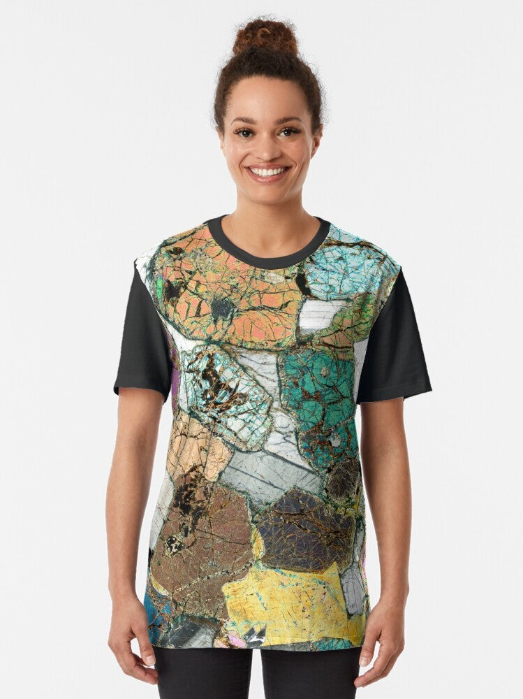 Graphic t-shirt featuring a microscope photo of peridotite, a type of geological rock from Ardnamurchan, Scotland. - Women