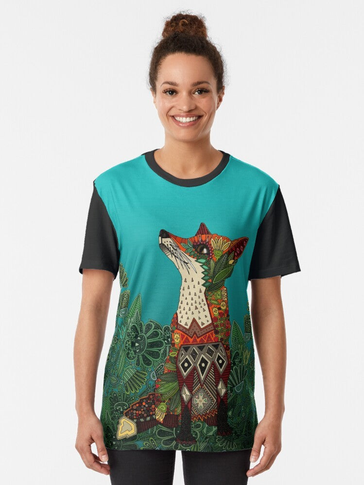 A floral fox graphic t-shirt featuring a colorful, botanical design with flowers, leaves, and a fox motif. - Women