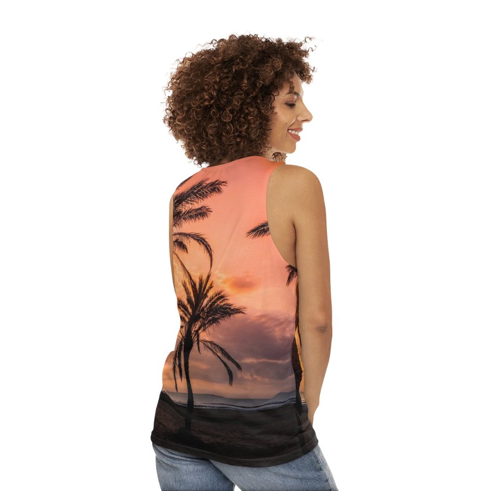 Unisex tank top with a tropical sunrise over palm trees design - women back