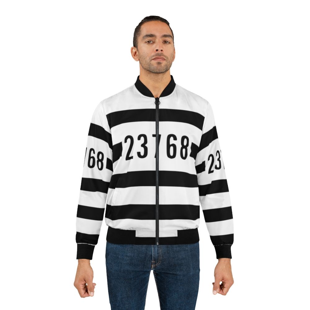 A bomber jacket with a Lego prisoner design, featuring the character The Brickster. - Lifestyle