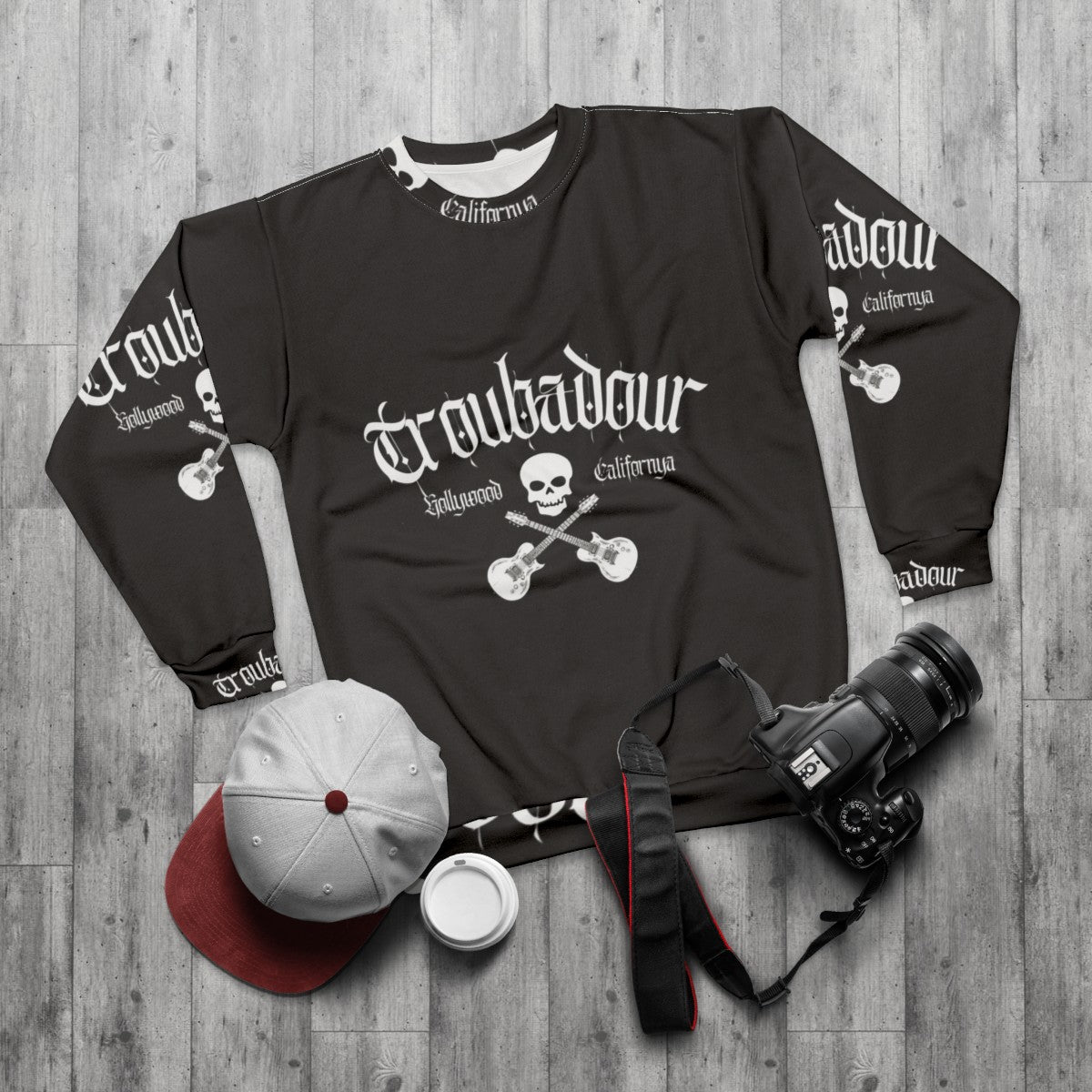 Troubadour Sweatshirt featuring classic 80s rock band skull graphic - flat lay