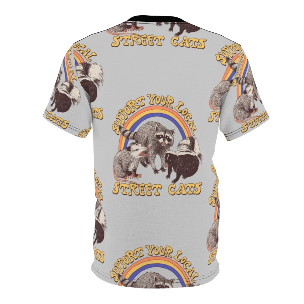 Retro-style AOP t-shirt featuring a colorful design of cats, possums, skunks, and raccoons in a fun, urban setting. - Back