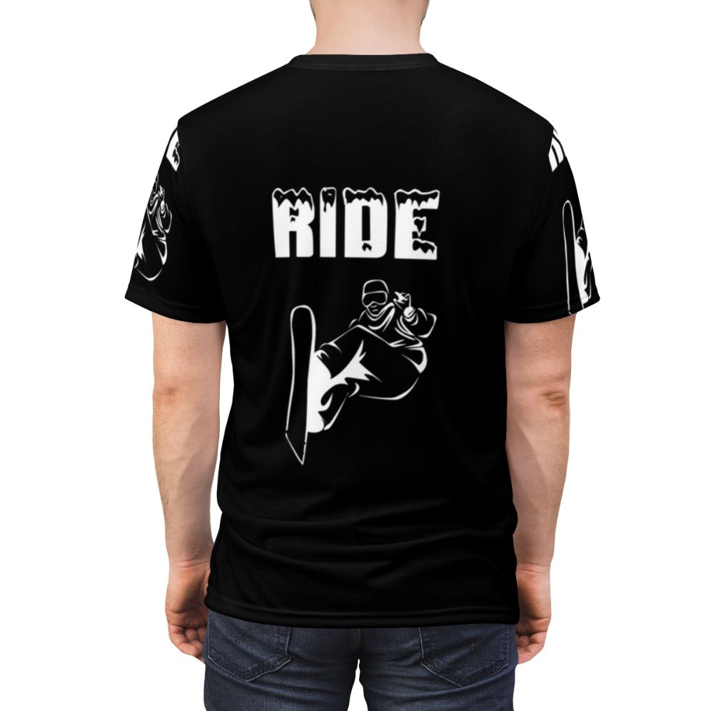 Unisex t-shirt featuring a graphic design of a person snowboarding down a snowy mountain slope - men back