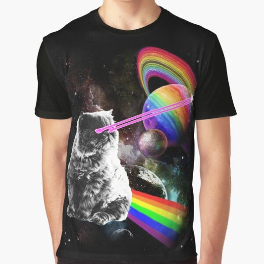 A graphic t-shirt design featuring a space cat with laser eyes surrounded by a rainbow galaxy and stars.