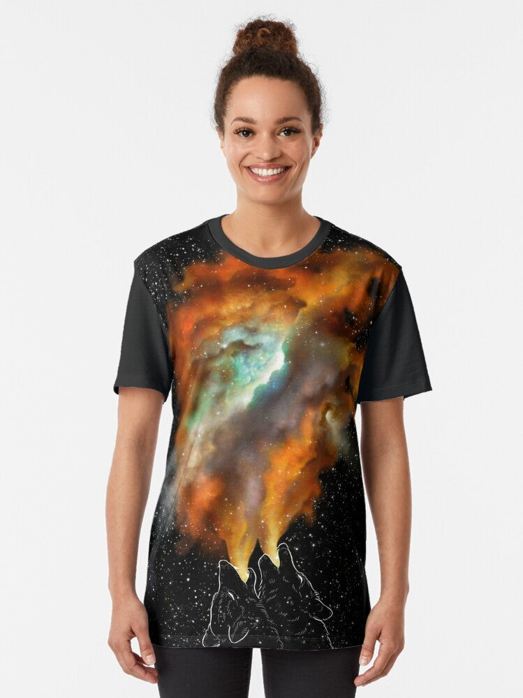 Graphic t-shirt featuring a design of wolves and stars in a cosmic, galaxy-inspired pattern. - Women