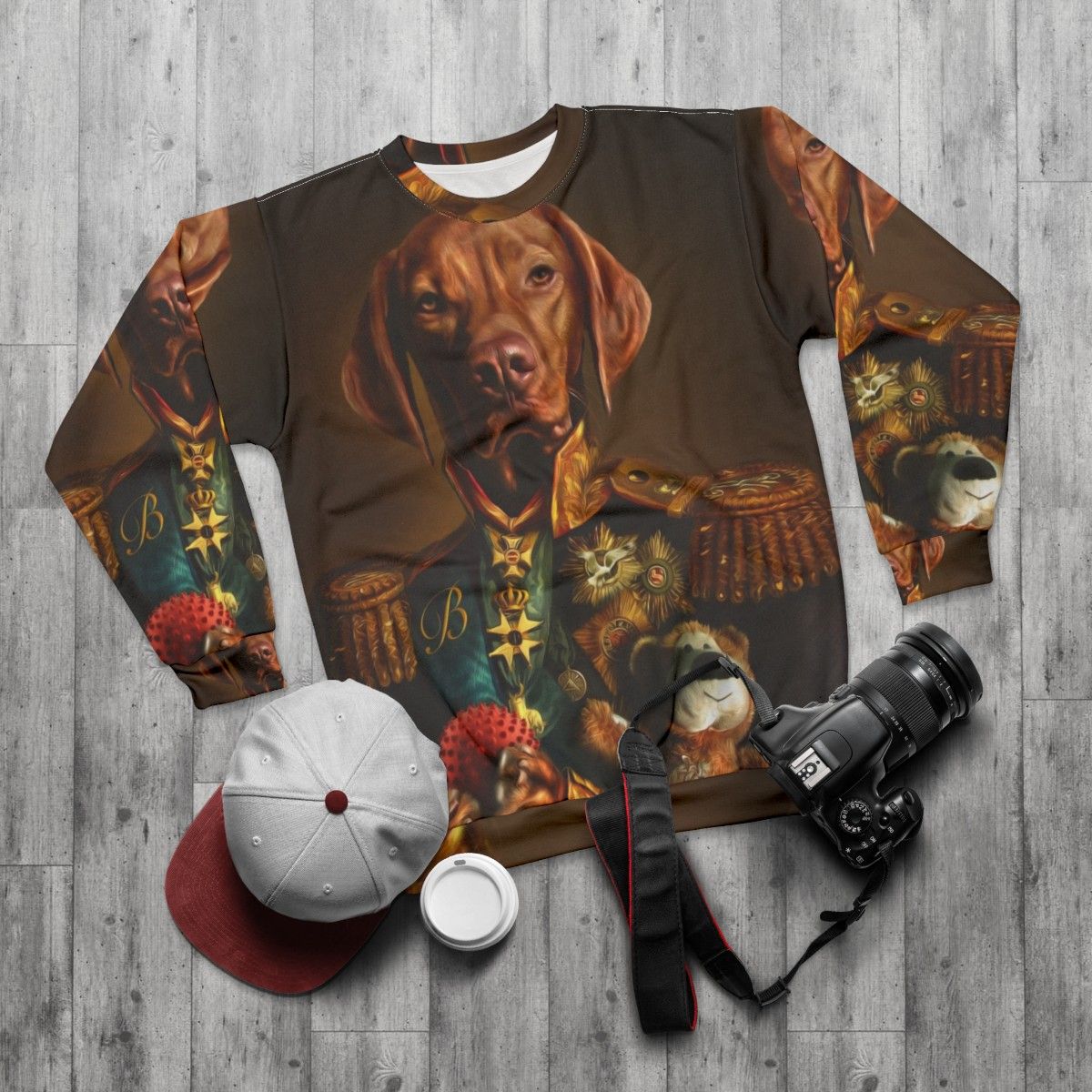 Hungarian Vizsla dog wearing a sweatshirt with a portrait of itself - flat lay