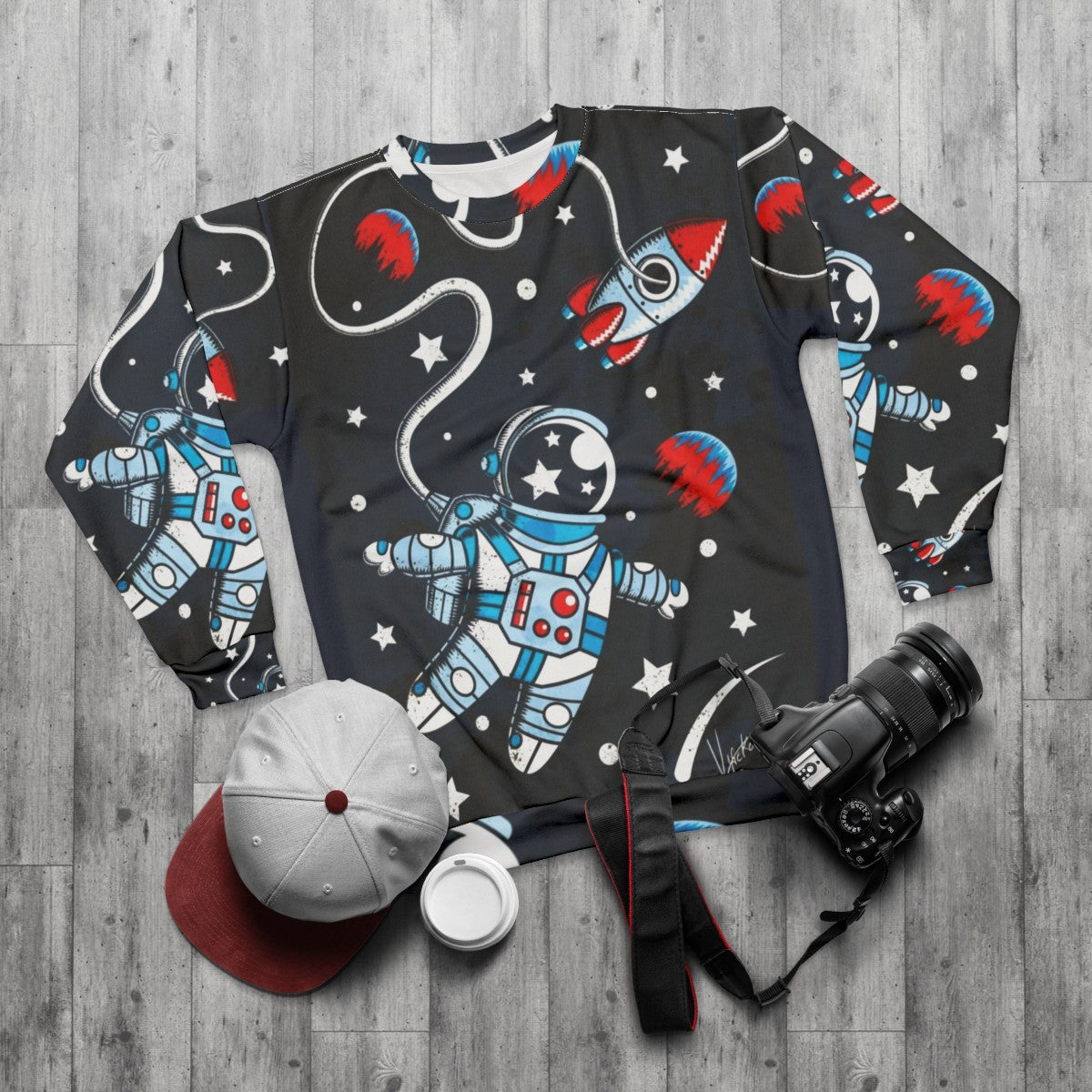 Space Walk Sweatshirt featuring a retro astronaut design - flat lay