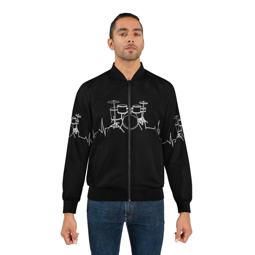 A bomber jacket with a graphic design featuring a drummer's heartbeat - Lifestyle