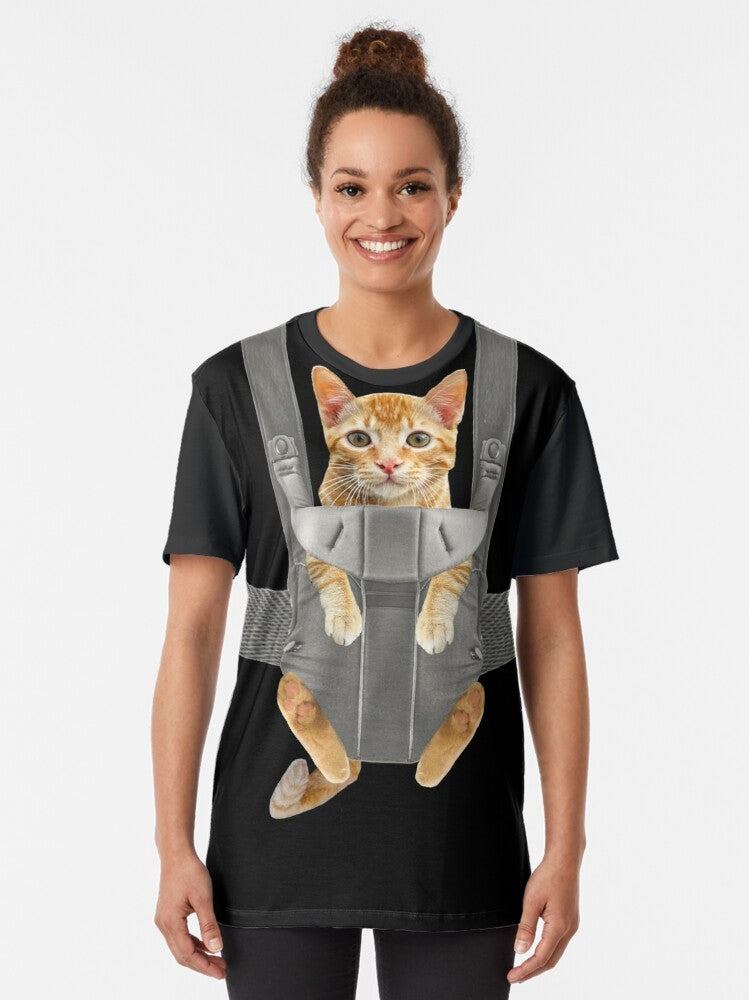 Monty the Funny Orange Cat in a Baby Carrier Graphic T-Shirt - Women