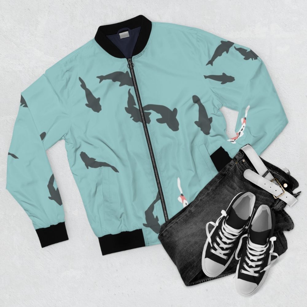 A bomber jacket featuring a minimalist koi fish design inspired by the anime "A Silent Voice" - Flat lay