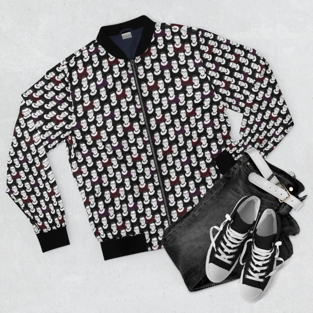 Bomber jacket featuring a bold, colorful pattern inspired by the legacy of Ruth Bader Ginsburg, the renowned Supreme Court justice and feminist icon. - Flat lay