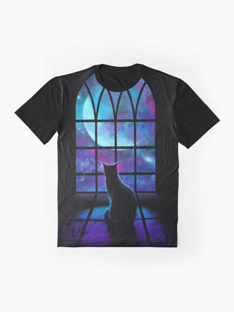 A graphic t-shirt featuring a cute cat in a space-themed design with planets, stars, and the moon. - Flat lay