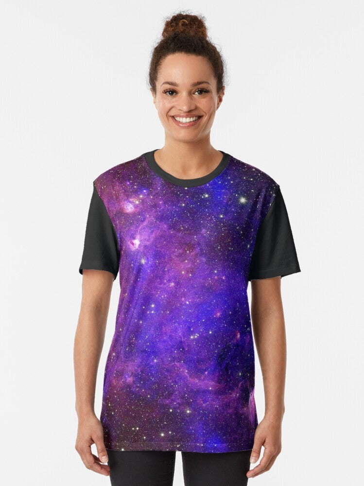 A colorful galaxy-inspired graphic t-shirt with stars, planets, and cosmic elements. - Women