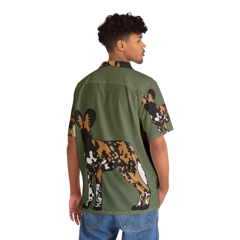 Colorful Hawaiian shirt featuring an African painted dog design - Flat lay