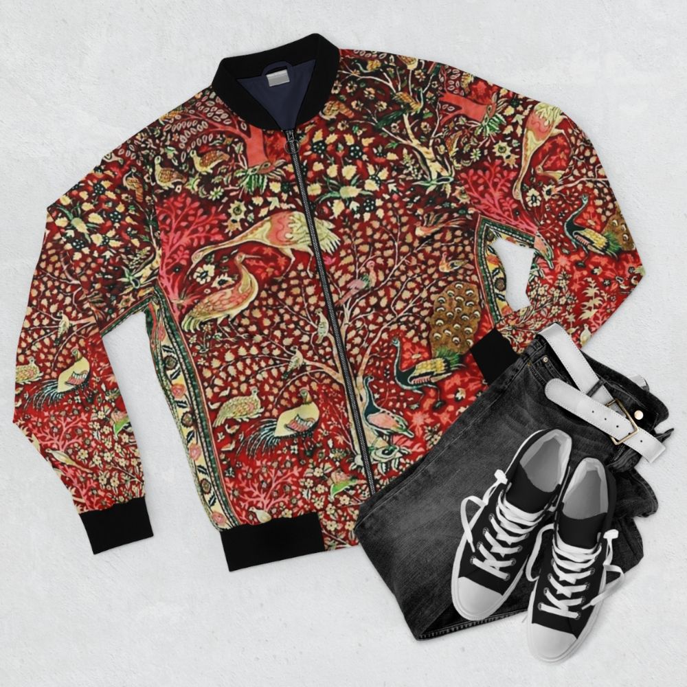 Vintage Persian rug bomber jacket with nature pattern featuring birds, trees, and flowers - Flat lay