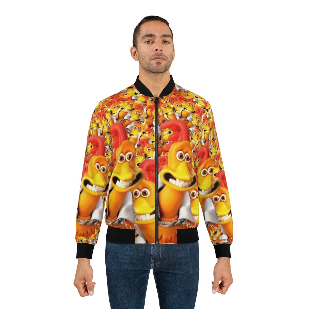 A red and orange bomber jacket with a graphic of "Rocky the Flying Rooster" from the classic animated comedy "Chicken Run". - Lifestyle