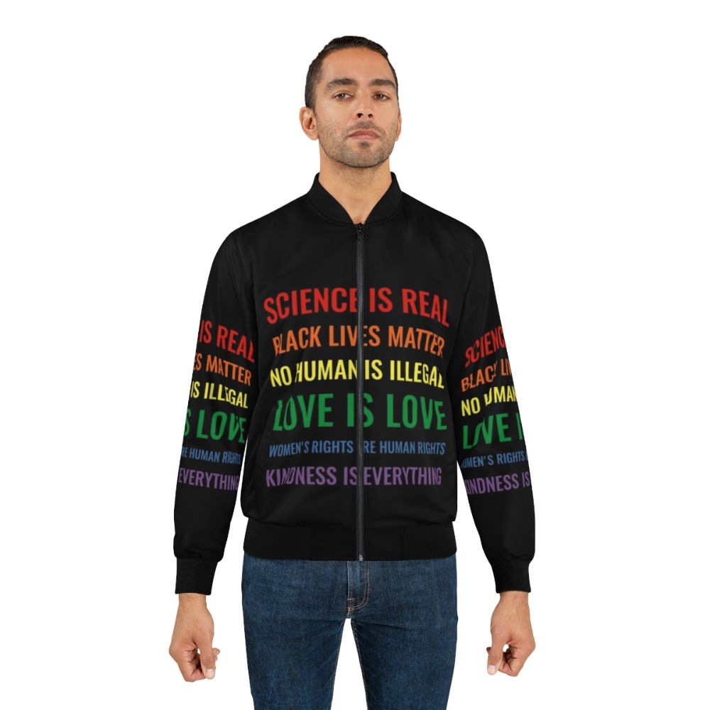 Bomber jacket with text "Science is real! Black lives matter! No human is illegal! Love is love! Women's rights are human rights! Kindness is everything!" - Lifestyle