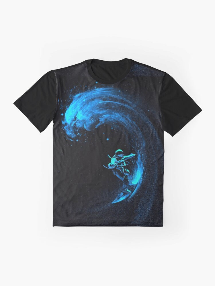 A graphic t-shirt design featuring an astronaut surfing through a colorful, cosmic galaxy filled with stars and swirling nebulas. - Flat lay