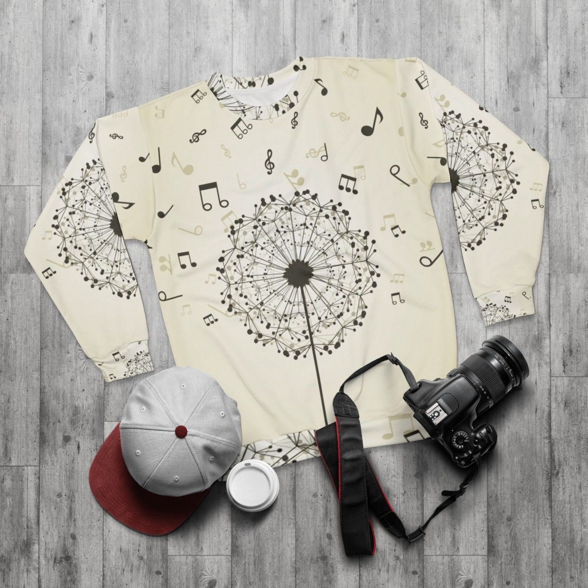 Music-themed sweatshirt with dandelion flower design - flat lay