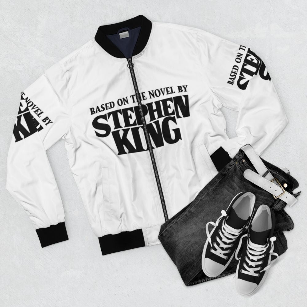 Stephen King inspired bomber jacket featuring horror elements - Flat lay