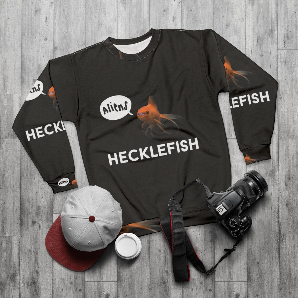 Hecklefish Graphic Sweatshirt featuring underwater mysteries and conspiracies - flat lay