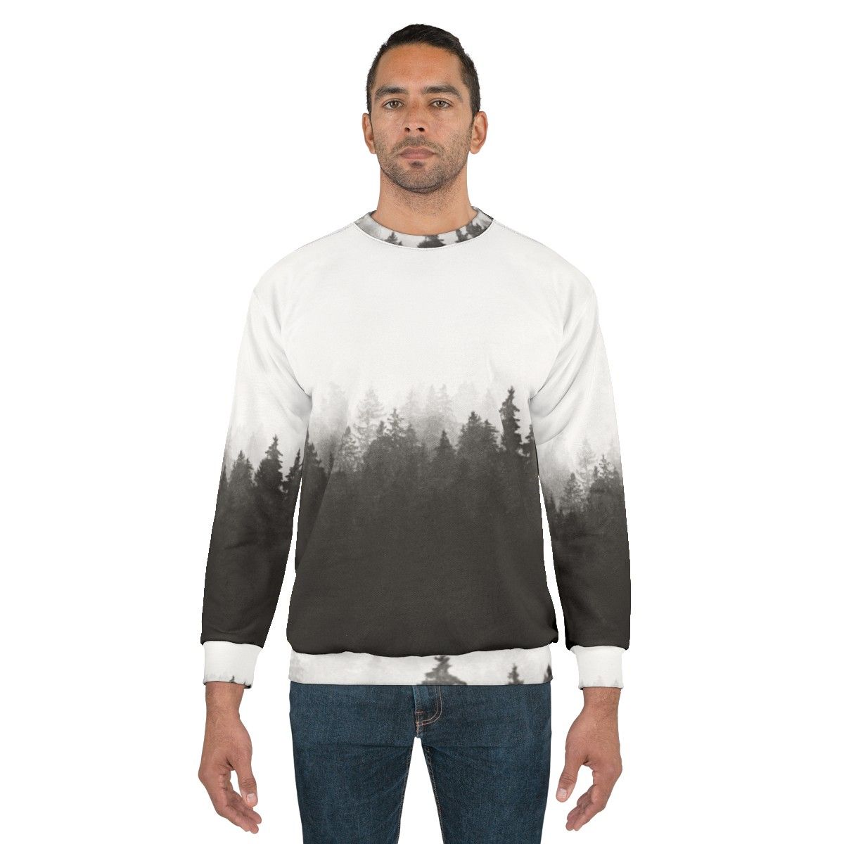 A person hiking in a foggy, forested landscape wearing a nature-inspired sweatshirt - men