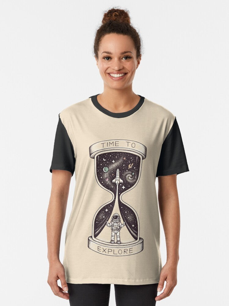 Astronaut exploring the galaxy with planets, stars, and an hourglass on a graphic t-shirt - Women