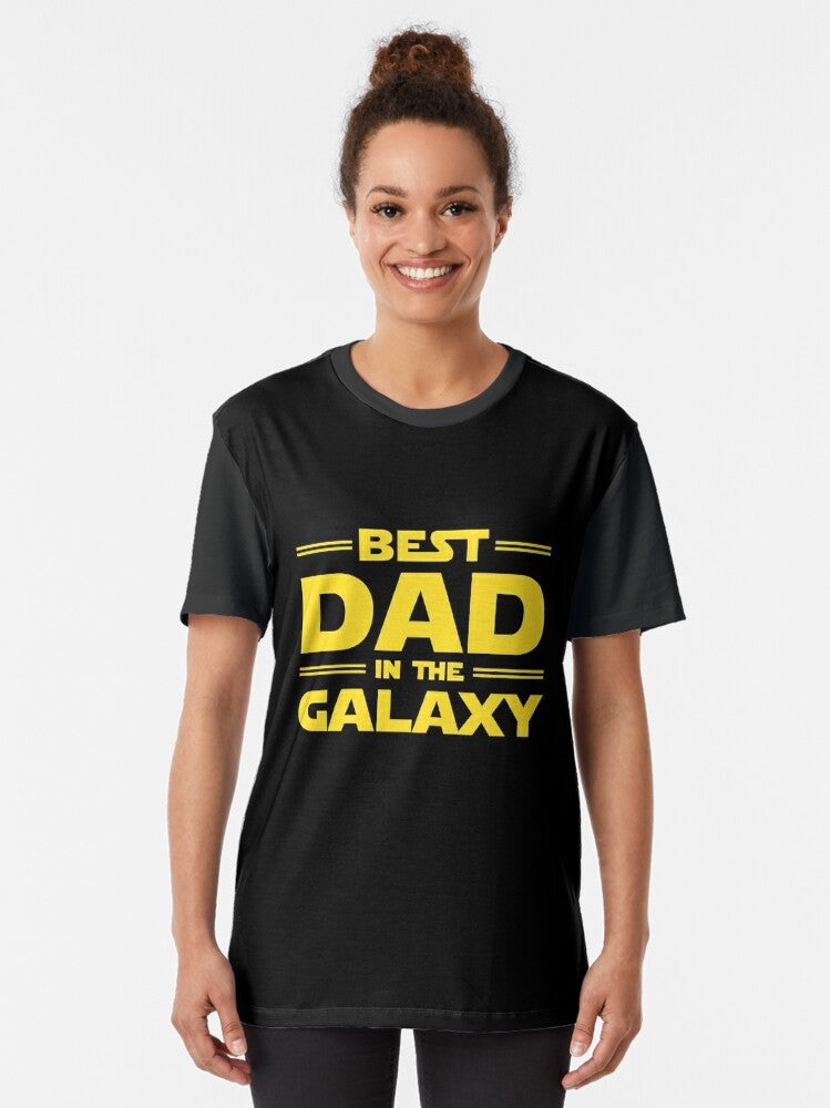 Best Dad in The Galaxy Graphic T-Shirt with a star, galaxy, and space design for fathers. - Women