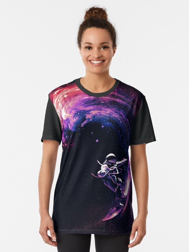 Cosmic space surfing graphic t-shirt with astronaut, galaxy, and stars design - Women