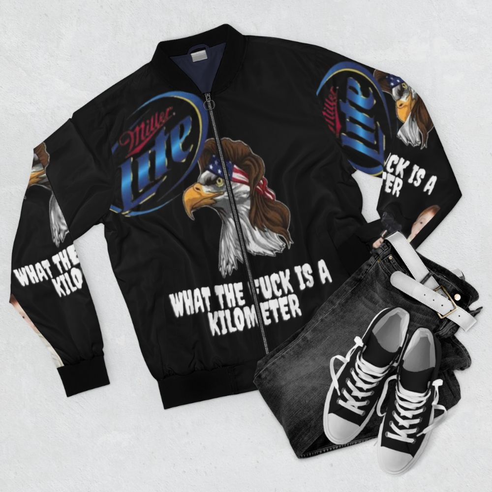 Funny American-themed bomber jacket with text "What the Fuck is a Kilometer?" - Flat lay