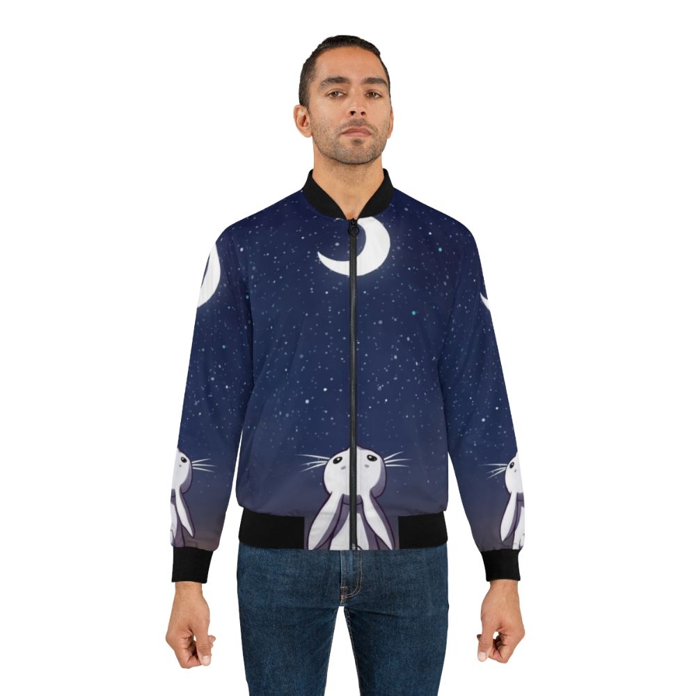 A blue children's bomber jacket with a cute bunny and moon design. - Lifestyle