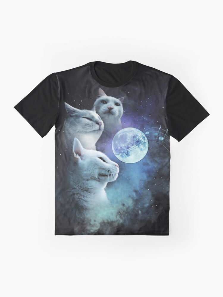 A graphic t-shirt featuring a cat vibing to music in a cosmic, galaxy-themed design with three cats and a moon. - Flat lay