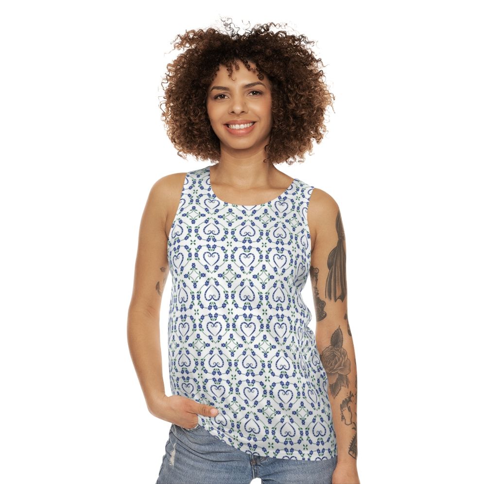 Blue unisex tank top with paw print and heart-shaped floral pattern - women