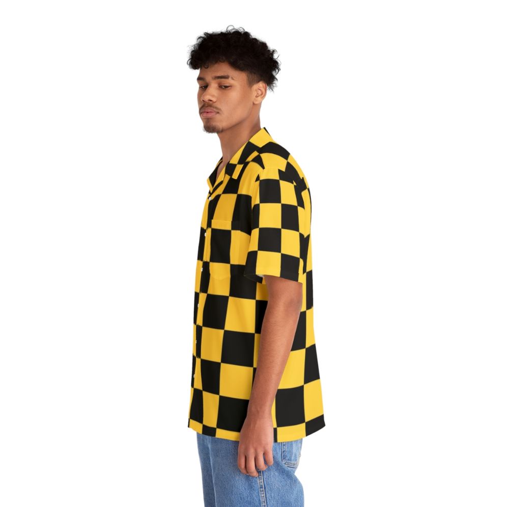 Man wearing a bold black and yellow checkered Hawaiian shirt - People Left