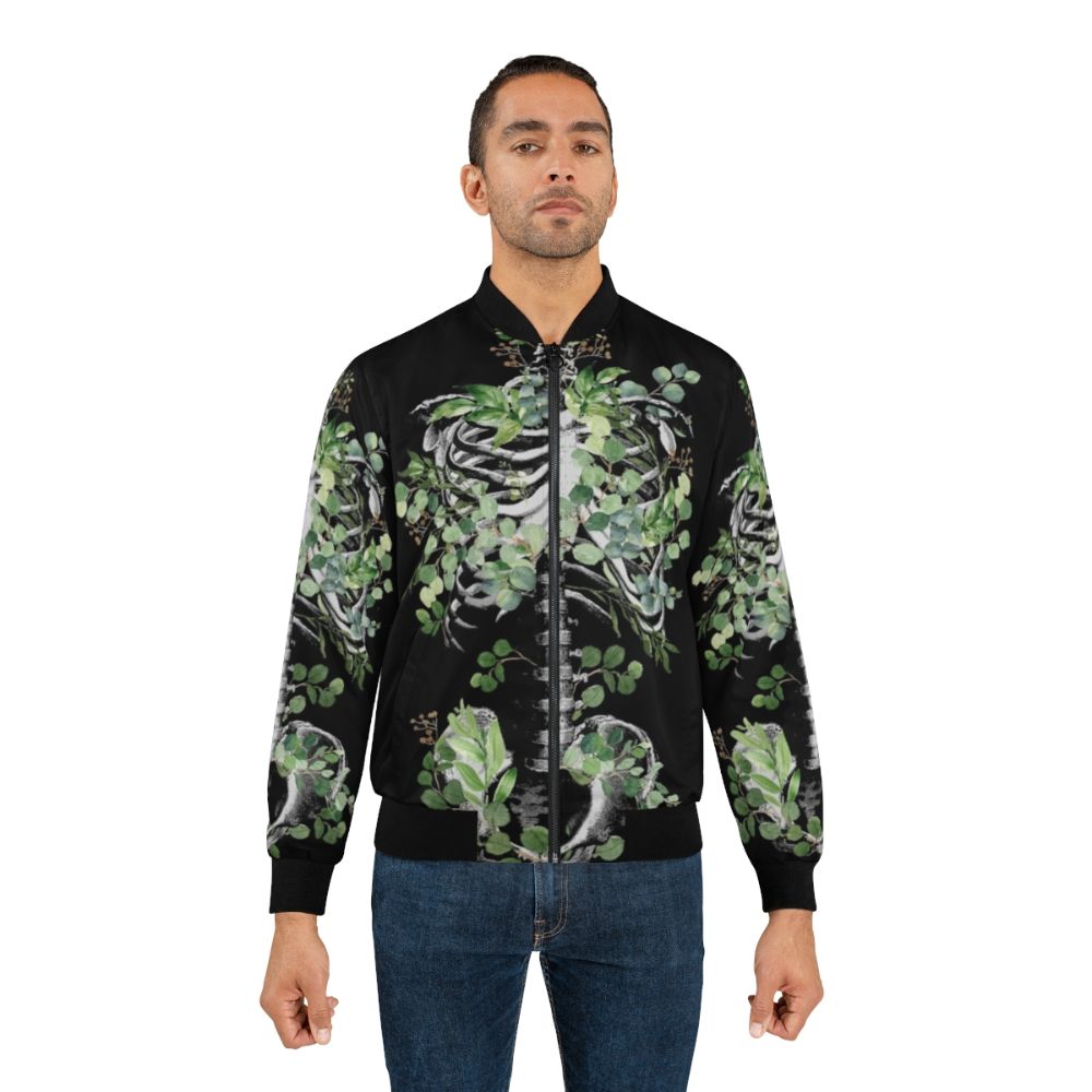 Botanical skeleton bomber jacket featuring rib cage, pelvis, and eucalyptus leaves floral design - Lifestyle