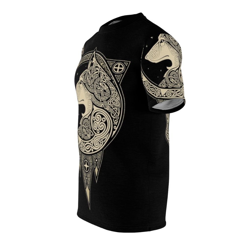 Photograph of a Norse-inspired t-shirt with a detailed wolf graphic, set against a background of celestial symbols and organic patterns. - men left