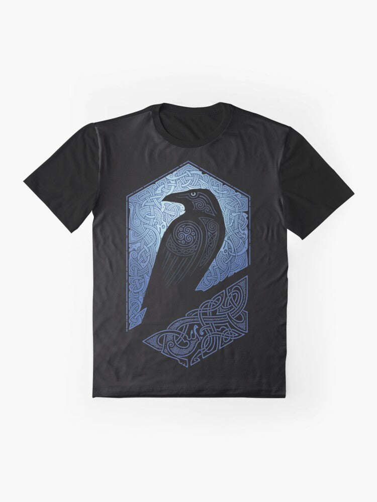 A graphic t-shirt featuring a silhouette of a raven or crow against a blue and black background with celtic and tribal design elements. - Flat lay