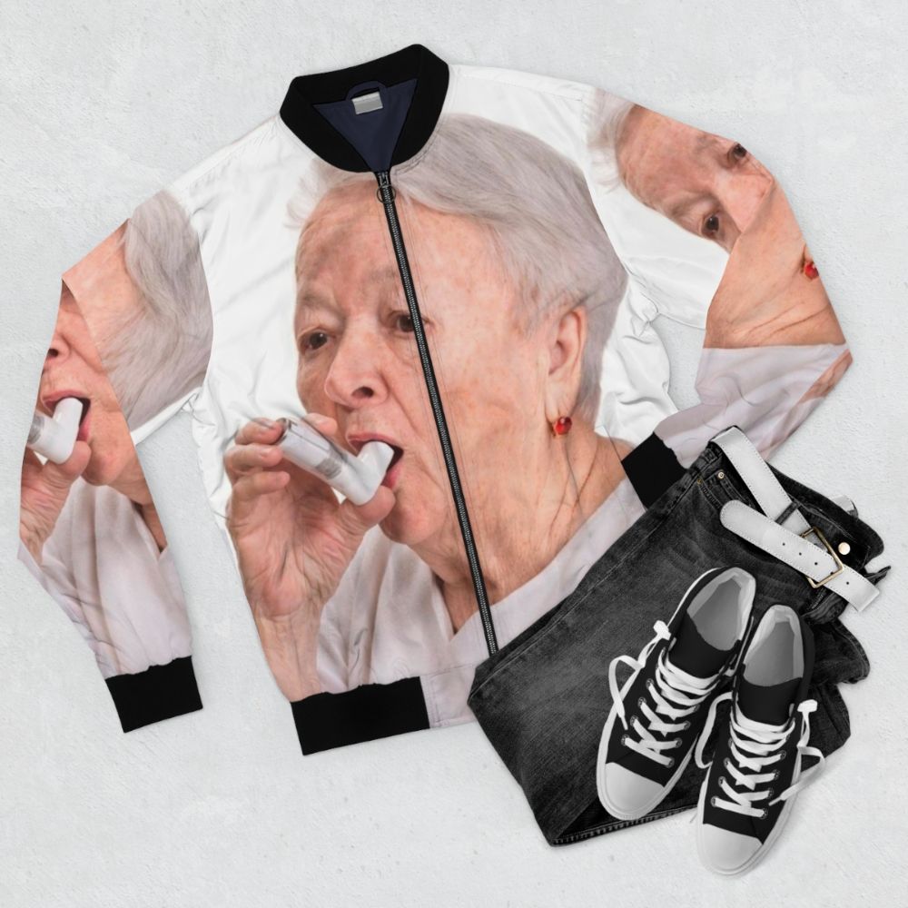 Vintage-style bomber jacket with a print of a retro inhaler device - Flat lay