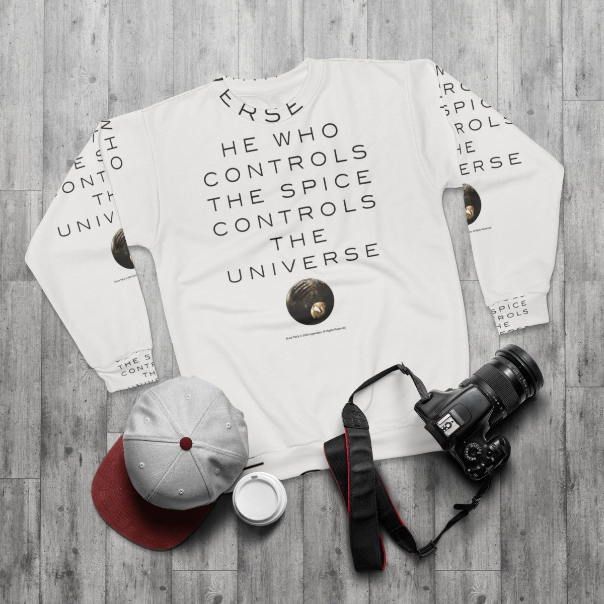 Dune-inspired sweatshirt featuring the quote "He Who Controls The Universe" - flat lay