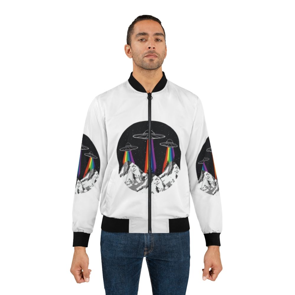 Colorful bomber jacket with a design featuring rainbow-colored mountains, a spaceship, and alien figures. - Lifestyle