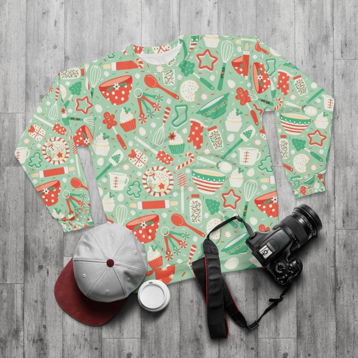 Christmas baking sweatshirt with festive holiday motifs - flat lay