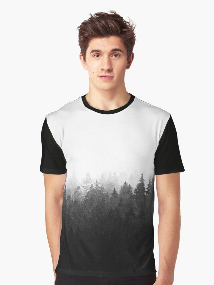 Graphic t-shirt featuring a wilderness landscape with trees, fog, and mountains - Men